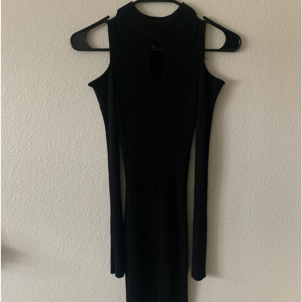 Say What brand ribbed, bodycon dress with cutout in the middle and on shoulders.